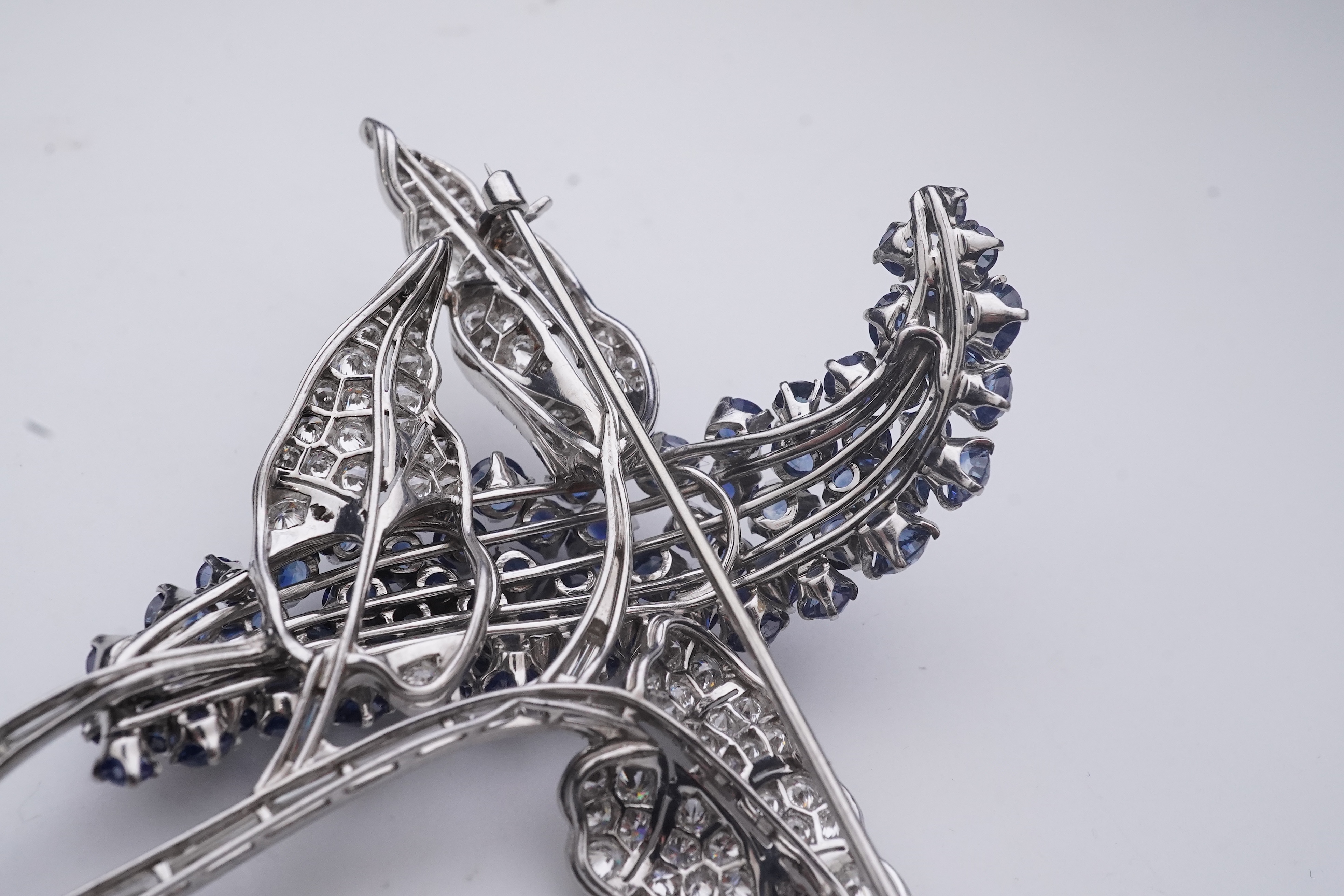 A sapphire and diamond brooch, mid 20th century